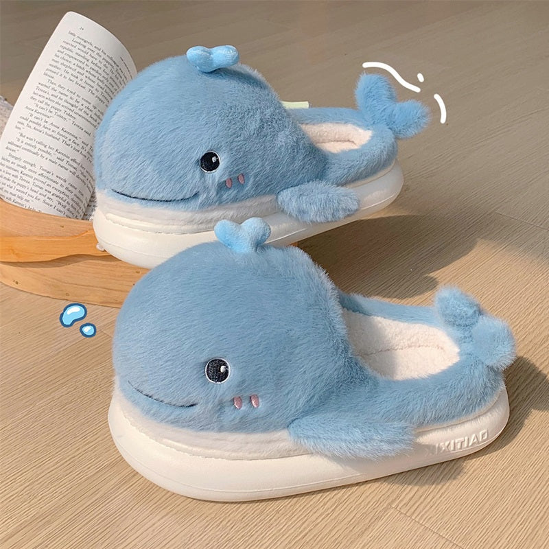 Light blue open-toe plush slippers shaped like a 3D whale with a top water spout and glossy eyes, soft indoor footwear with EVA sole