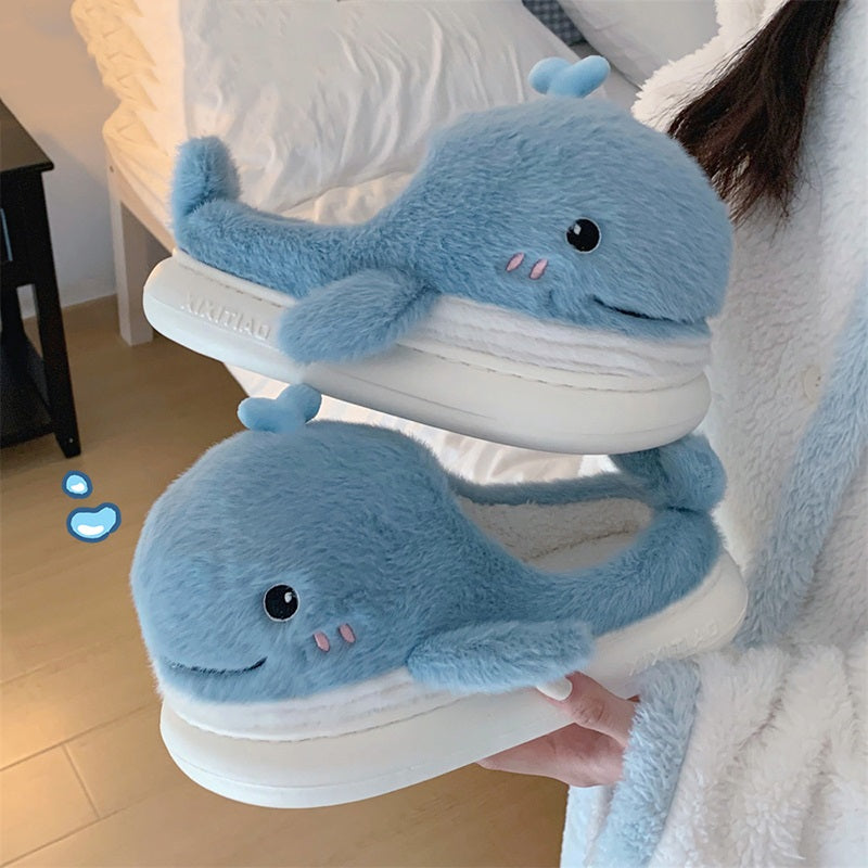 Light blue open-toe plush slippers shaped like a 3D whale with a top water spout and glossy eyes, soft indoor footwear with EVA sole