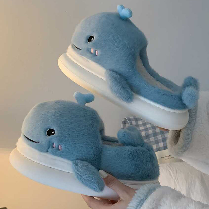 Light blue open-toe plush slippers shaped like a 3D whale with a top water spout and glossy eyes, soft indoor footwear with EVA sole