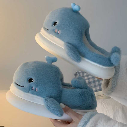Light blue open-toe plush slippers shaped like a 3D whale with a top water spout and glossy eyes, soft indoor footwear with EVA sole