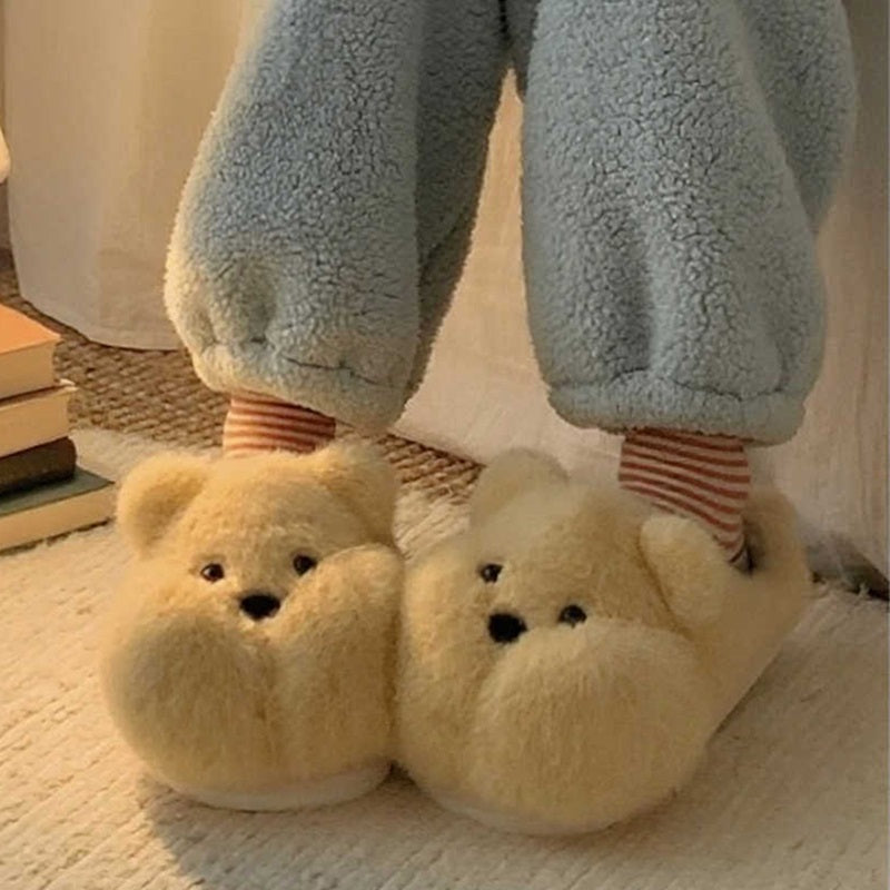 Yellow chubby bear plush slippers featuring a rounded silhouette, small ears, and black dot eyes, soft indoor footwear with PVC sole