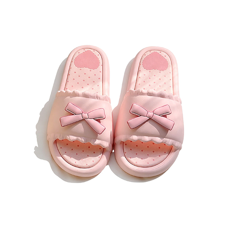 Pink EVA slide sandals with a matching 3D pink bow and white scalloped edge, durable indoor shoes with patterned footbed
