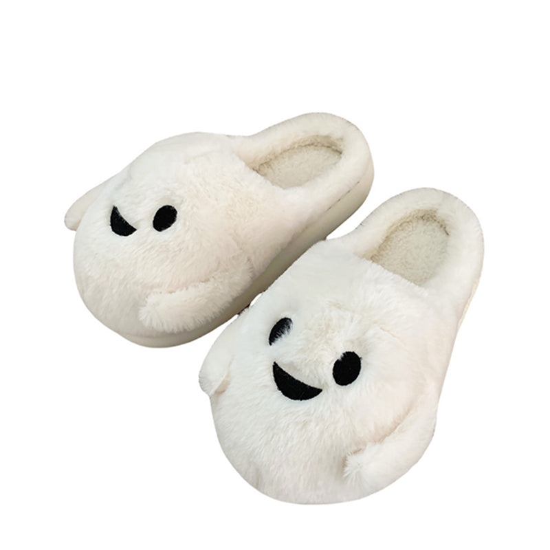 Playful white Halloween ghost face plush slippers featuring black dot eyes and a wavy smile, soft indoor footwear with EVA sole