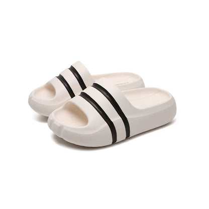 White wide-strap EVA slide sandals with black double stripes, all-EVA low-arch indoor shoes