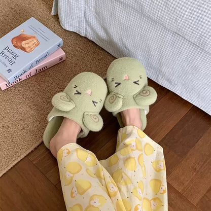 Green fleece sheep slippers designed with pink spiral ears and a smiling closed-eye look, lightweight fabric sole home shoes