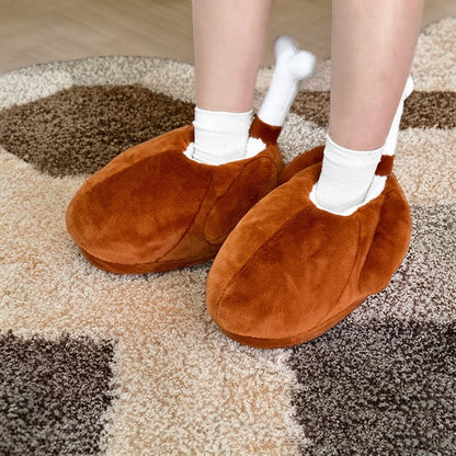 Brown turkey leg shaped indoor slippers with a white fabric bone accent and plush hanging wings, lightweight non-waterproof fabric sole holiday footwear