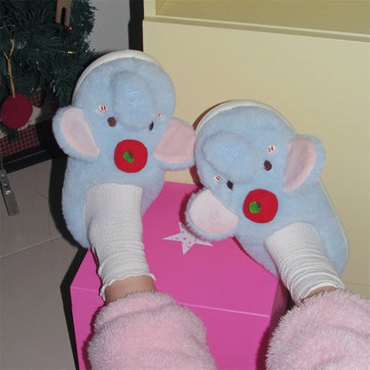 Blue plush elephant slippers with large pink ears and a red apple top decoration, cozy indoor footwear with EVA sole