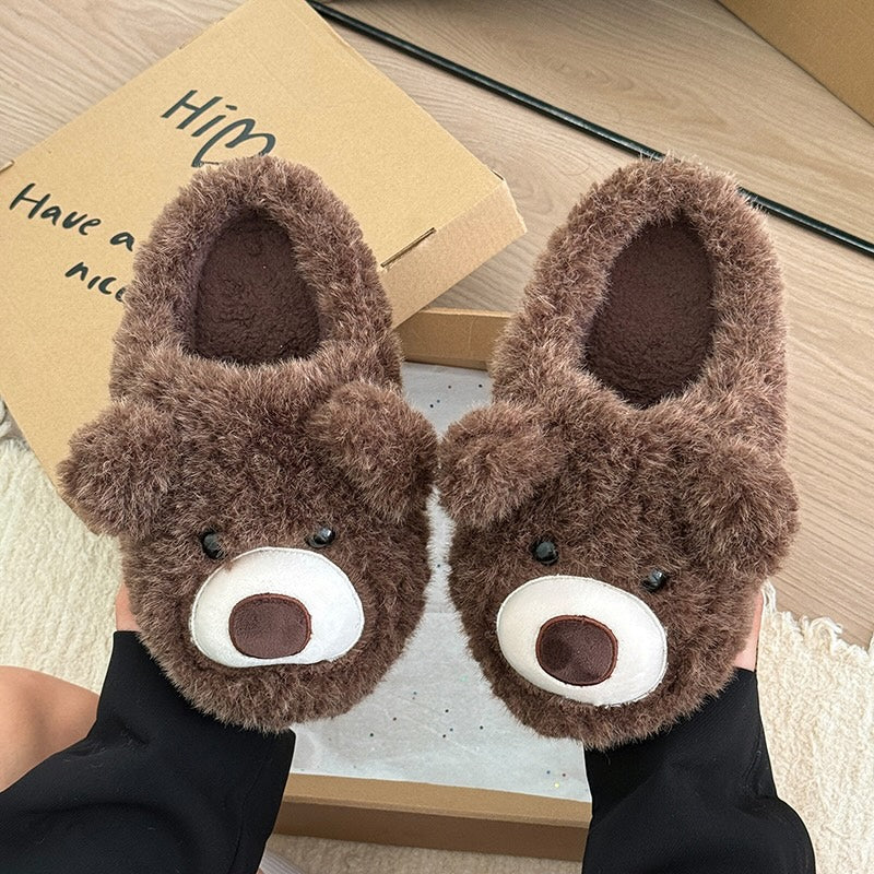 Dark brown shaggy bear plush slippers with a large white muzzle patch and a central fabric nose, cozy indoor footwear with TPR sole