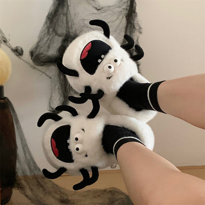 White plush spider monster slippers with big black mouth and spooky legs, indoor footwear with EVA sole