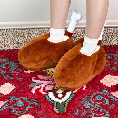 Brown turkey leg shaped indoor slippers with a white fabric bone accent and plush hanging wings, lightweight non-waterproof fabric sole holiday footwear