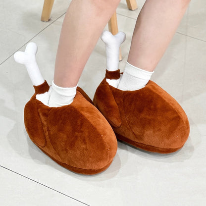 Brown turkey leg shaped indoor slippers with a white fabric bone accent and plush hanging wings, lightweight non-waterproof fabric sole holiday footwear