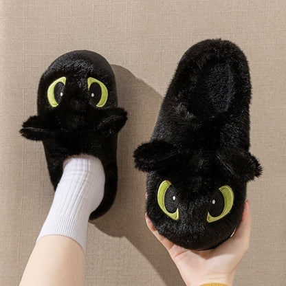 Black plush dragon slippers with big white-highlight eyes and small 3D ears, soft indoor home shoes with PVC sole