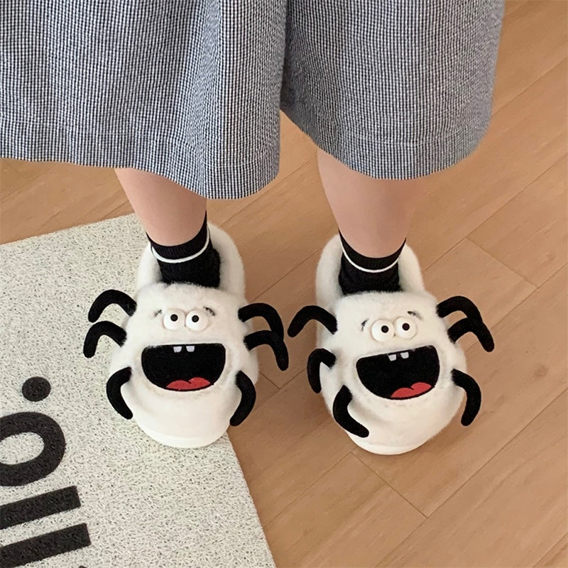 White plush spider monster slippers with big black mouth and spooky legs, indoor footwear with EVA sole